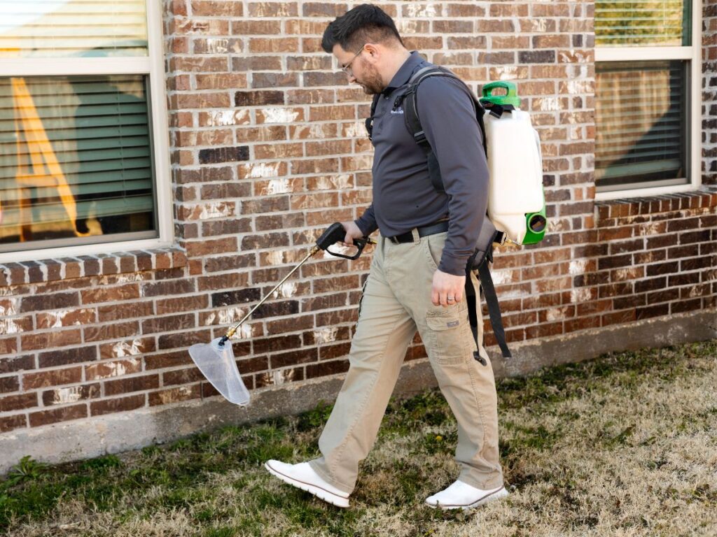 Preferred Pest Management technician performing affordable pest control service in Richardson, TX